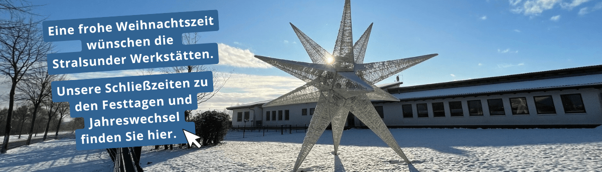 Ein großer Stern steht vor der schneebedeckten Hauptwerkstatt der Stralsunder Werkstätten.